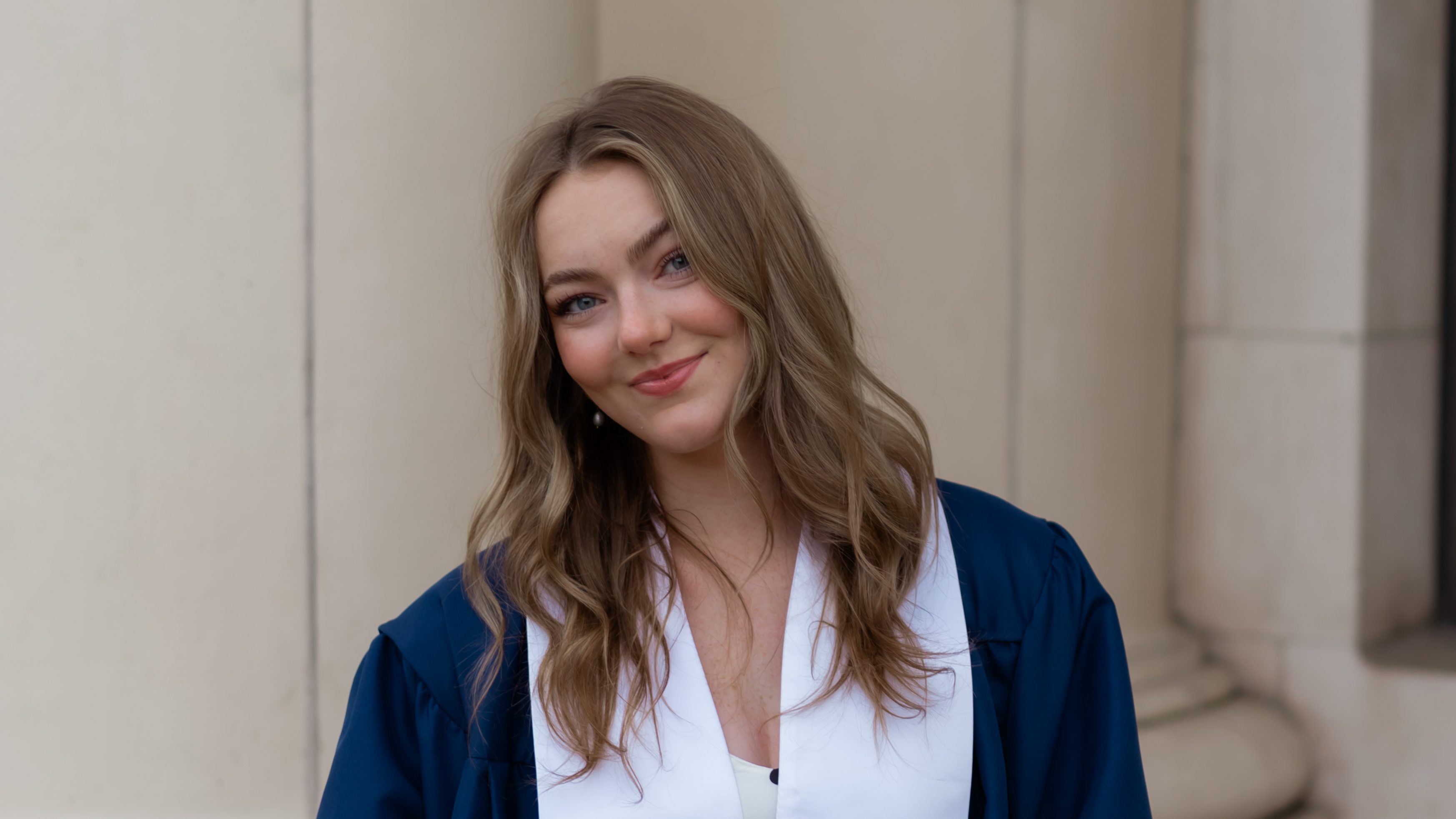 Picture of Lia smiling in BYU cap and gown.